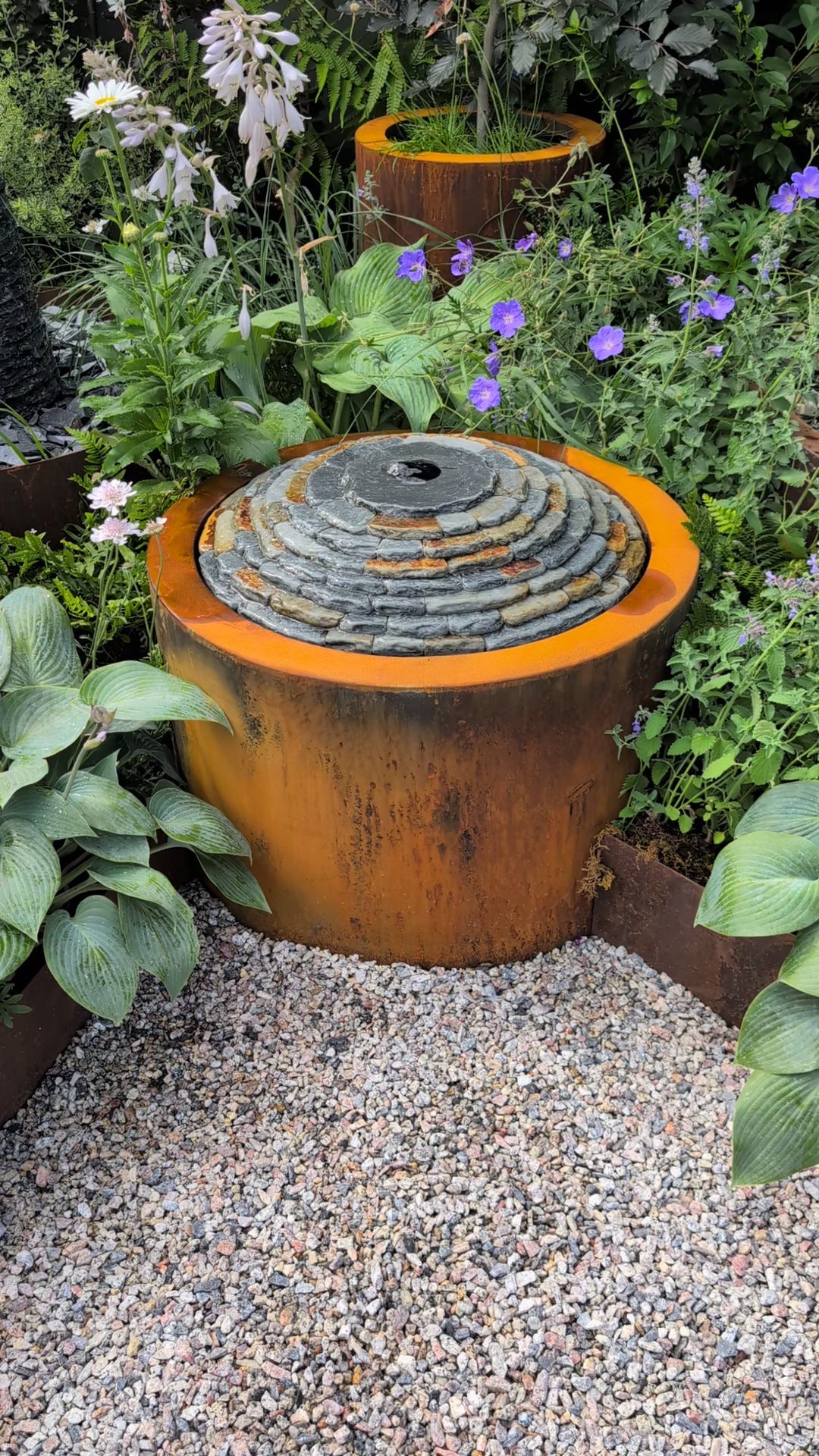 Zoom in video to show a close up of the water feature flowing and the relaxing sound.